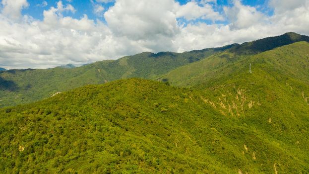 Mountains covered with jungle and rainforest on the island of Mindanao, Philippines. Tropical landscape in Asia.