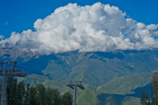Mountain landscape against cloudy blue sky in Krasnaya Polyana Sochi