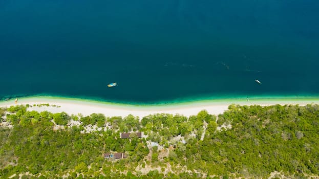 Tropical island with sand beach, top view. Great Santa Cruz Island in Zamboanga city. Mindanao, Philippines.
