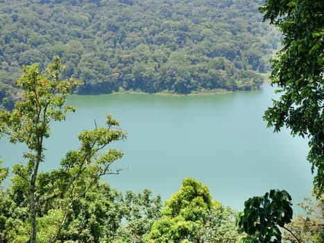 Lake Buyan,caldera lake at Bali. Beautiful lake with turquoise water in the mountains of the island of Bali. Landscape, lake among mountains, sky, clouds.