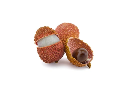 Lychee fruit whole, opened and showing seed isolated on white background