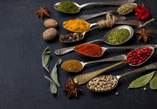 Various spices spoons on table. Top view with copy space