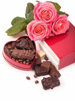 Beautiful rose and dark chocolate for valentine day on isolate white background.