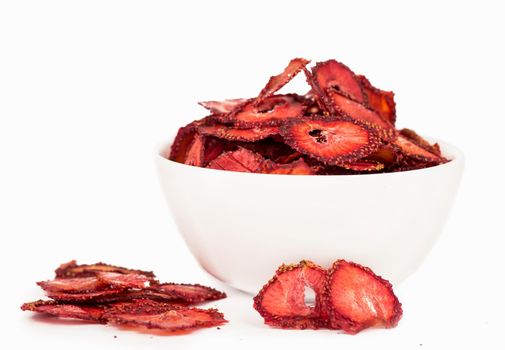 dry strawberry in a white plate it is isolated