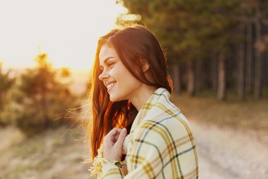 Women outdoors in the mountains at sunset near forest. High quality photo