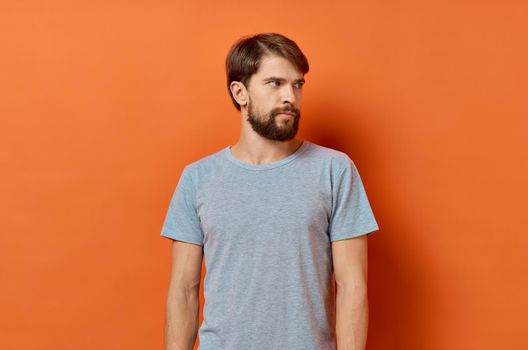 bearded man in gray t-shirt lifestyle Studio isolated background. High quality photo