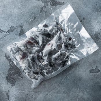 Frozen mussels in sash set, on gray background