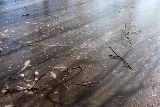 Snow covered frozen lake landscape in northern europe on a sunny day