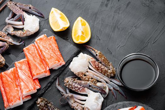 Crab sticks seafood semi finished fish mince with blue swimming crab set, on black background, top view flat lay , with copyspace and space for text