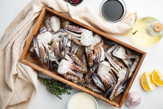 Fresh raw Blue Swimming Crab ocean gourme parts set, in wooden box, on white background, top view flat lay