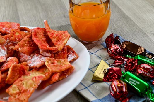 composition of typical carnival dessert, Frappe, fruit juice and chocolates