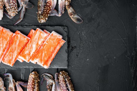 Asian snack surimi set, on black background, top view flat lay , with copyspace and space for text