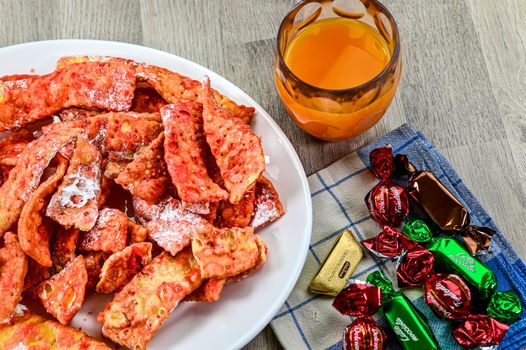 composition of typical carnival dessert, Frappe, fruit juice and chocolates
