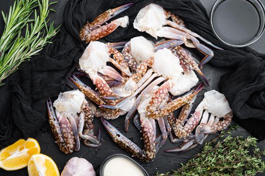 Fresh raw Horse crab, Blue crab, Flower crab set, on black background, top view flat lay