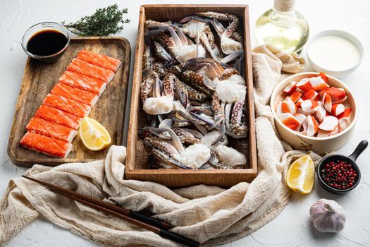 Fresh Crab meat and sticks surimi with blue swimming crab set, on white background
