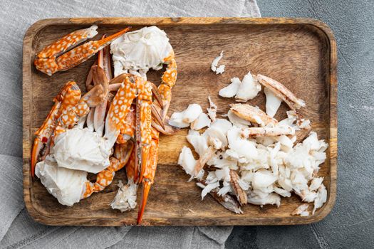 Boiled blue swimming crab claws set, on gray background, top view flat lay
