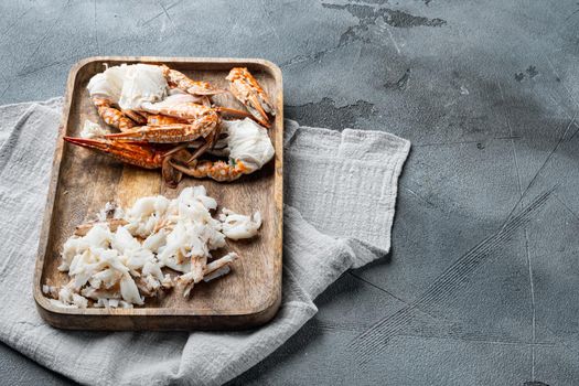 Cooked crab claws and legs meat set, on gray background , with copyspace and space for text