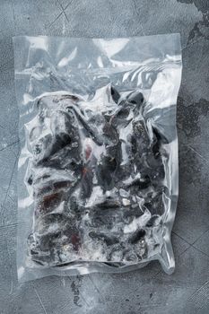 Frozen Mussels vacuum packed set, on gray background, top view flat lay
