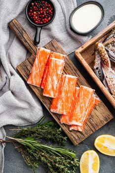Fresh Crab meat stick surimi set, on gray background, top view flat lay