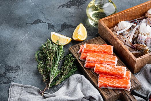 Crab sticks seafood semi finished fish mince with blue swimming crab set, on gray background , with copyspace and space for text