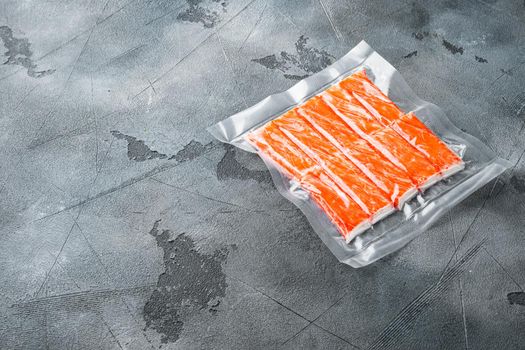 Crab stick surimi vacuum pack set, on gray background , with copyspace and space for text