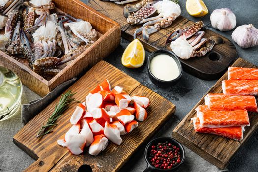 Fresh Crab meat and sticks surimi with blue swimming crab set, on gray background