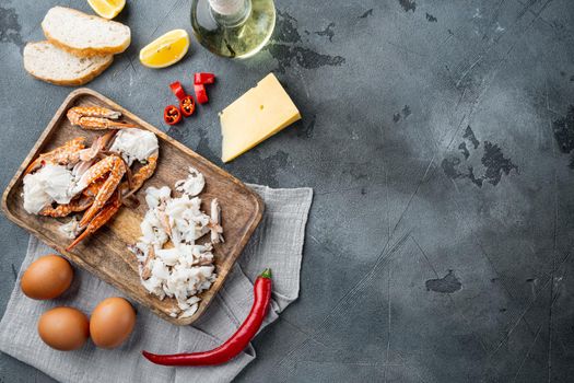 Omelette ingredients with pepper, crab meat, egg, cheese set, on gray background, top view flat lay , with copyspace and space for text