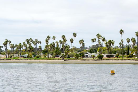 Caravan and home trailer park area next the water in the De Anza Cove in Mission Bay area in San Diego, California, USA. April, 22nd, 2020