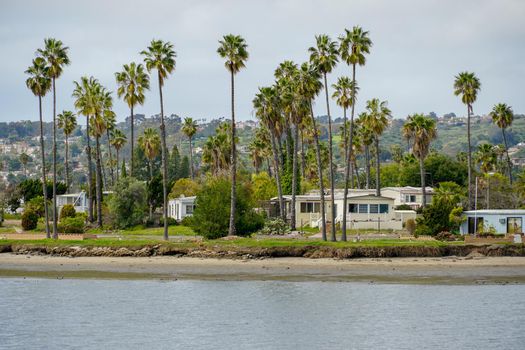 Caravan and home trailer park area next the water in the De Anza Cove in Mission Bay area in San Diego, California, USA. April, 22nd, 2020