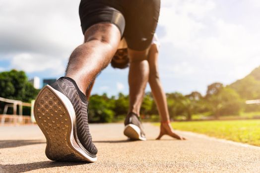 Asian young athlete sport runner black man active ready to start running training at the outdoor on the treadmill for a step forward, healthy exercise workout, closeup back on feet shoe