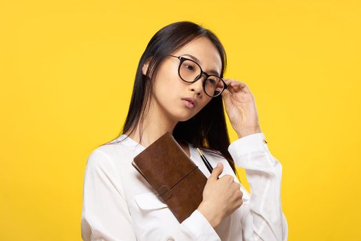 women with glasses notepad in the hands of an official office lifestyle. High quality photo