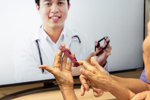 Elderly woman using physical therapy online service at home.