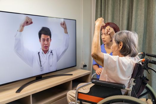 Elderly woman using physical therapy online service at home.