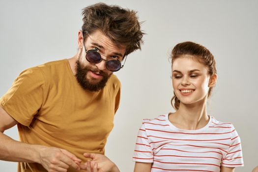 Man in sunglasses next to woman in communication fun friendship lifestyle. High quality photo