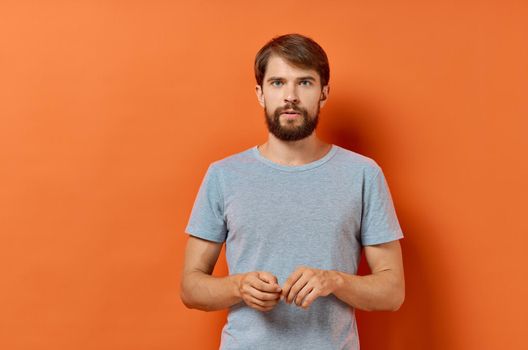 bearded man in gray t-shirt lifestyle Studio isolated background. High quality photo