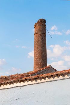 Old chimney of an abandoned factory in southern Spain, with a nice blue sky