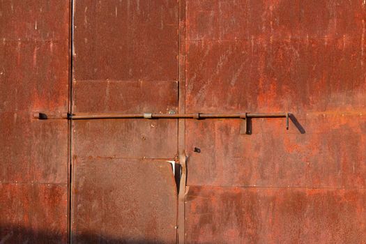 Old door of an abandoned factory in southern Spain, with a nice patina