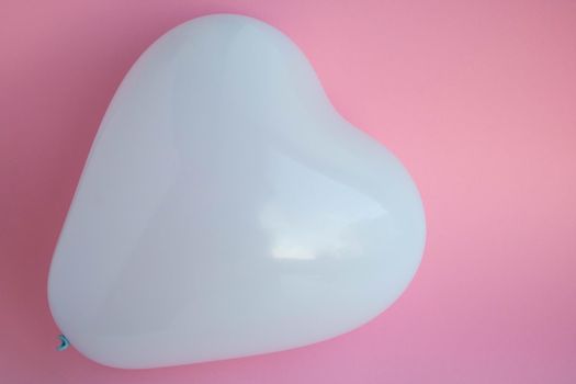 Blue balloon in the shape of a heart on a pink background. Wedding concept, Valentine's Day, photo zone, lovers. Banner. top view. Space for your text