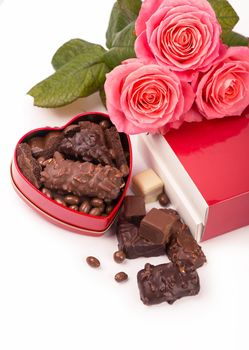 Beautiful rose and dark chocolate for valentine day on isolate white background.