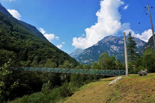 Wire rope bridge in front of the beautiful landscape of the Verzasca valley, Ticino, Switzerland
