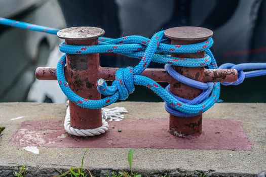 Blue ship's mooring rope on a blurry background.