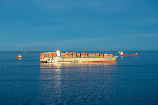 Seascape with a large container ship on the background of the sea. Vladivostok, Russia