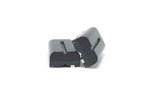 Two NP-F type rechargeable batteries isolated on a white background, electronics and camera equipment
