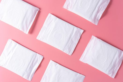 Pattern of Sanitary pad, Sanitary napkin on pink background. Menstruation, Feminine hygiene, top view.