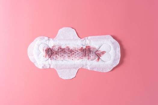 Used Sanitary pad with full amount of blood, Sanitary napkin on pink background. Menstruation, Feminine hygiene, top view.