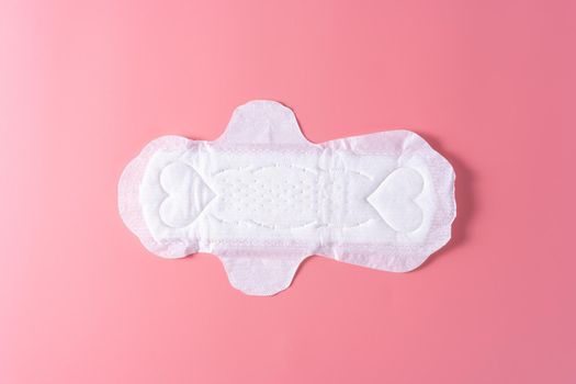 Sanitary pad, Sanitary napkin on pink background. Menstruation, Feminine hygiene, top view.