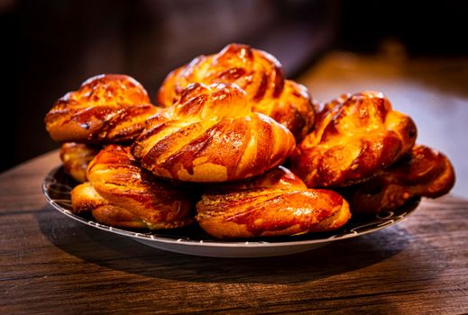 A group of homemade cinnamon rolls on a plate