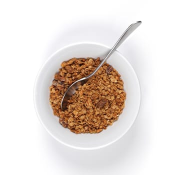 A bowl of granola with spoon on white background with shadow
