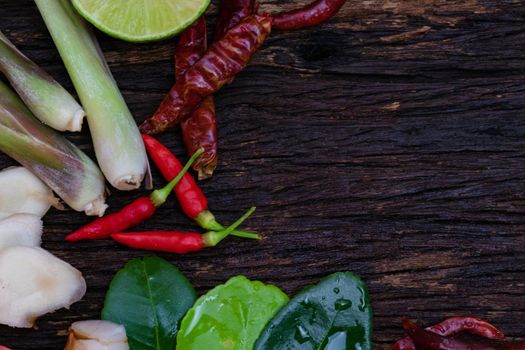 Thai food ingredient for Tom yum on old wooden background.