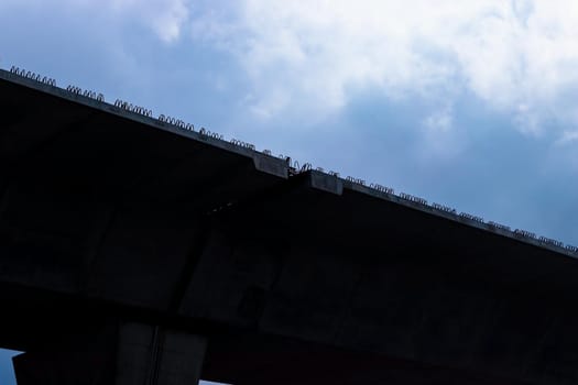 Silhouette of expressway under construction.